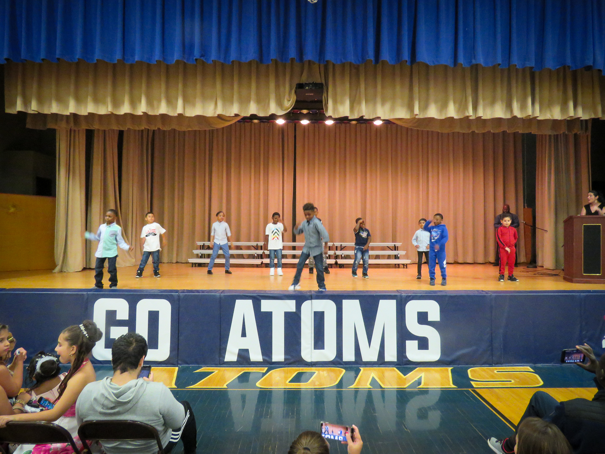 Atoms perform singing and dancing routines during their spring concert and talent show