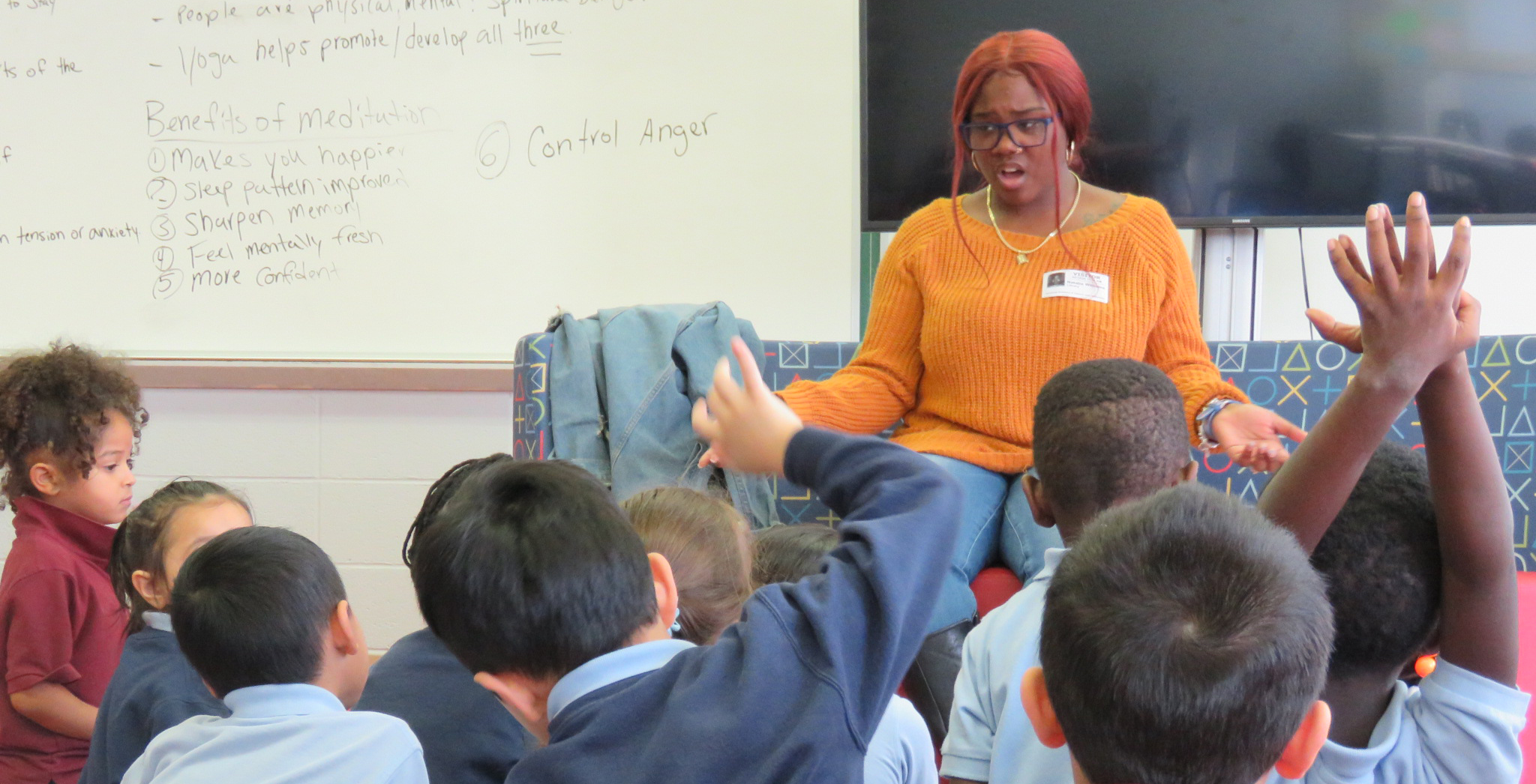 Syracuse Academy of Science Alumna Reads to Kindergarten Students