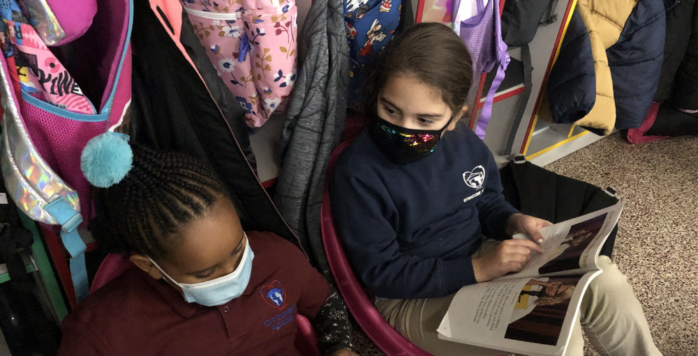 Syracuse Academy of Science and Citizenship 2nd grade students team up for partner reading to work on their reading fluency, comprehension, and teamwork skills.